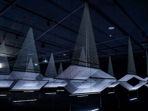 Muhannad Shono (Saudi Arabia), Letters in light, Lines we write, 2023, thread, steel, light projection, commissioned by Diriyah Biennale Foundation.