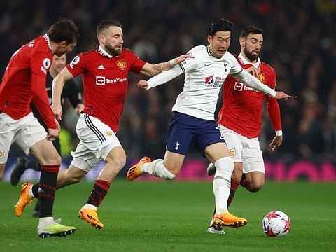 Manchester United's Luke Shaw and Bruno Fernandes vies with Tottenham Hotspur's Son Heung-min during their Premier League match on Thursday.