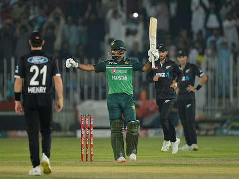 Pakistan's Fakhar Zaman (C) celebrates after scoring 150 runs during the second one-day international (ODI) cricket match between Pakistan and New Zealand at the Rawalpindi Cricket Stadium in Rawalpindi, on April 29, 2023.