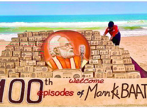 Sand artist Sudarsan Pattnaik creates a sand sculpture celebrating the 100th episode of Prime Minister Narendra Modi's 'Mann Ki Baat', at Puri Beach on Saturday, April 29, 2023.