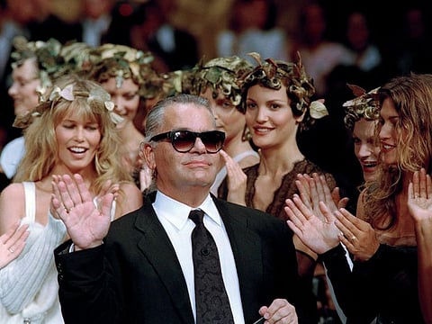 German fashion designer Karl Lagerfeld acknowledges at the Metropolitan Museum of Art's Costume Institute. (AP Photo/Lionel Cironneau, File)