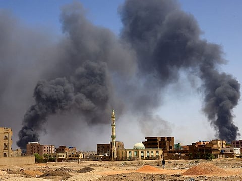 Smoke rises above buildings after aerial bombardment, during clashes between the paramilitary Rapid Support Forces and the army in Khartoum North, on May 1, 2023.