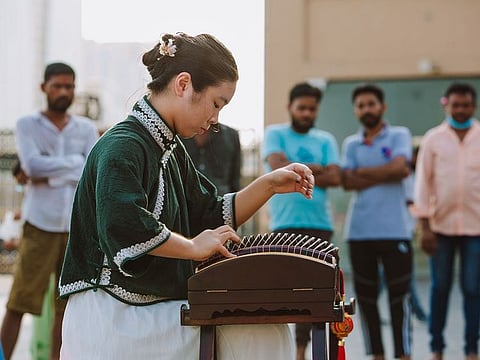 With her guzheng, Feng hopes to inspire more people to pick up their traditions and brighten others’ day via music, where needed.