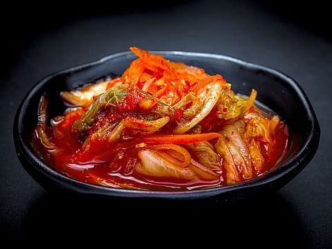 Kimchi is made by fermenting various vegetables with salt and adding seasonings such as green onions, garlic, ginger, red pepper powder, and salted fish.
