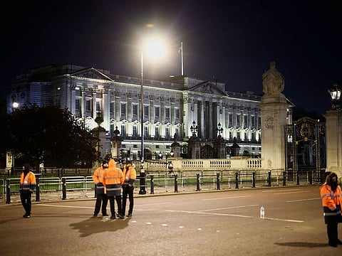 Security forces stand guard after British police arrested a man outside Buckingham Palace for throwing what they believe were shotgun cartridges, in London, Britain May 2, 2023.