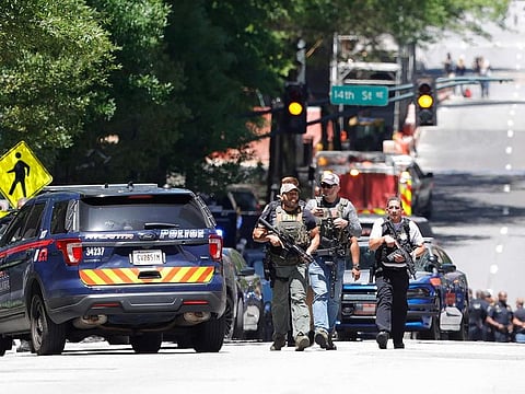 Law enforcement officers arrive near the scene of an active shooter on Wednesday, May 3, 2023 in Atlanta.