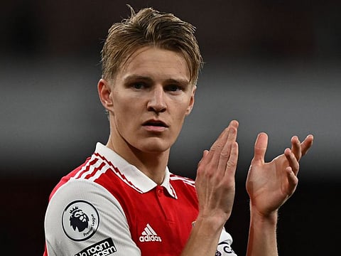 Arsenal midfielder Martin Odegaard applauds the fans following the English Premier League win against Chelsea at the Emirates Stadium in London on Tuesday.