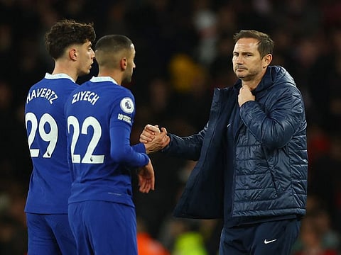 Chelsea manager Frank Lampard shakes hands with Kai Havertz and Hakim Ziyech after the match.