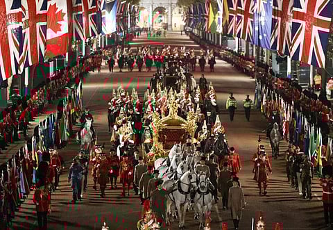 The Gold State Coach is ridden alongside members of the military during a full overnight dress rehearsal of the Coronation Ceremony of Britain’s King Charles and Camilla, Queen Consort in London, Britain, May 3, 2023.