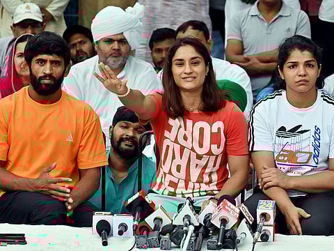 Wrestlers Bajrang Punia, Vinesh Phogat and Sakshi Malik address the media during a press conference on the protest against WFI chief Brij Bhushan Singh, at Jantar Mantar in New Delhi on April 30, 2023. The silence of fellow sportspersons and celebrities has been deafening.