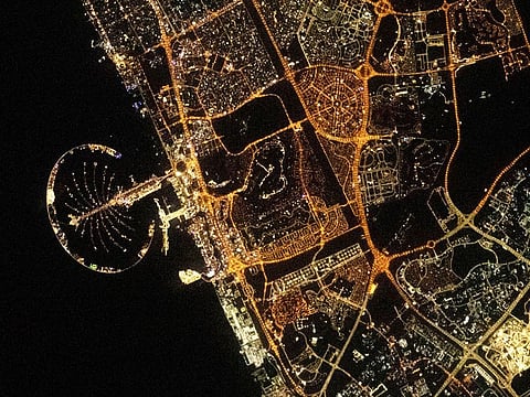 The lit-up outline of the Palm Jumeirah in Al Neyadi's picture dominates the coastline of Dubai