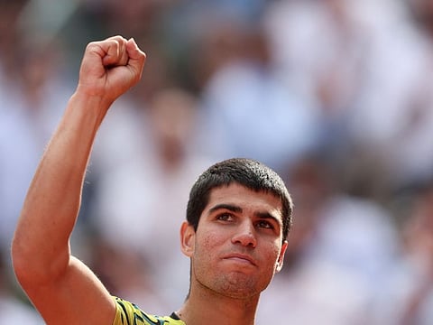 Spain's Carlos Alcaraz celebrates beating Russia's Karen Khachanov in Madrid on Wednesday.