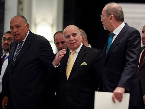 Jordan's Foreign Minister Ayman Safadi with Iraqi's Foreign Minister Fouad Hussain and Egypt's Foreign Minister Sameh Shoukry, in Amman, Jordan May 1, 2023.