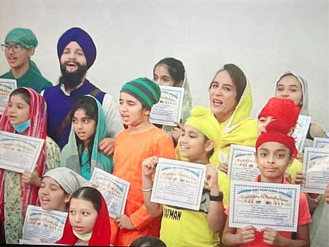 Kushwant Singh with his students: Striking the right note.