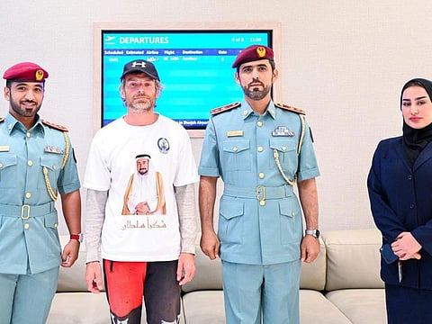 The European tourist with Sharjah Police officials.