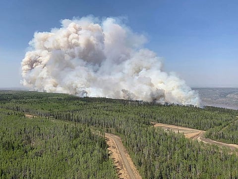 A wildfire burns a section of forest in the Grande Prairie district of Alberta, Canada.