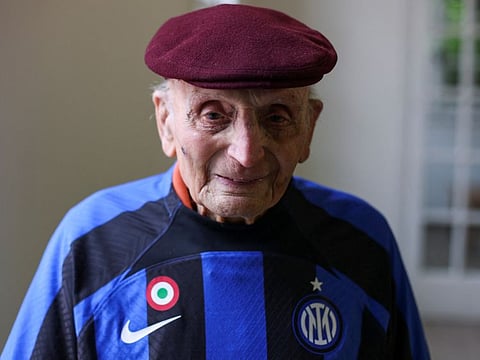 Enrico Vanzini, 100, an Italian military personnel during the Second World War, with Inter Milan jersey in Padua on Monday.
