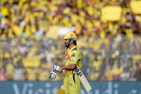 Chennai Super Kings' Mahendra Singh Dhoni walks-in to bat with a sea of yellow fans at the backdrop in Chennai.