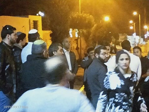 People gather near Ghriba synagogue following an attack on Tuesday, in Tunisia, May 9, 2023.