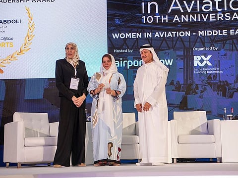 Mona Al Abdoli receives the Women in Aviation Leadership Award at the Women in Aviation 10th Anniversary Conference.