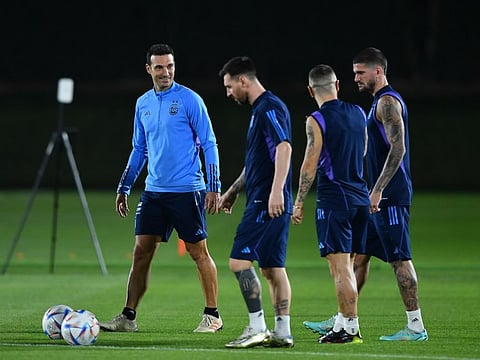 Argentina coach Lionel Scaloni with Lionel Messi during a training session. The coach wants his star player to be happy, irrespective of the club he plays in.