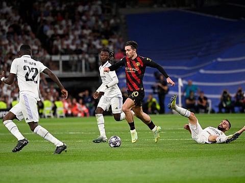 Manchester City's English midfielder Jack Grealish (second from right) vies with Real Madrid's Dani Carvajal during the Uefa Champions League semifinal first leg on Tuesday.