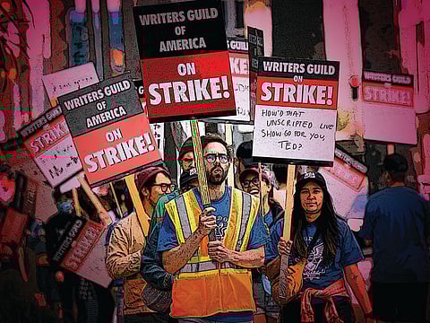 Writers Guild of America members and supporters picket outside Sunset Bronson Studios and Netflix Studios, after union negotiators called a strike for film and television writers, in Los Angeles, California, US, on May 3, 2023. The negotiations centred around how much writers should be compensated for their work on films, TV shows and streaming series.