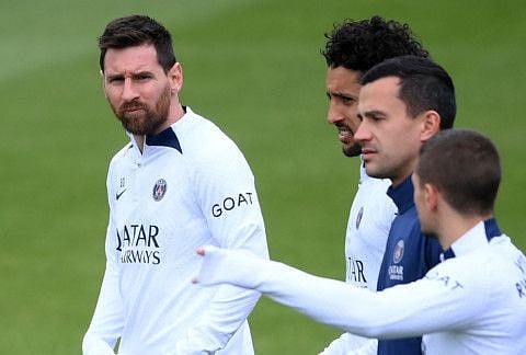 Paris Saint-Germain's Argentine forward Lionel Messi (left looks on during a training session in Saint-Germain-en-Laye in north-western outskirts of Paris on Friday.