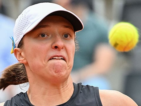 Poland's Iga Swiatek eyes the ball as she returns to Russia's Anastasia Pavlyuchenkova during their second round match on Friday.