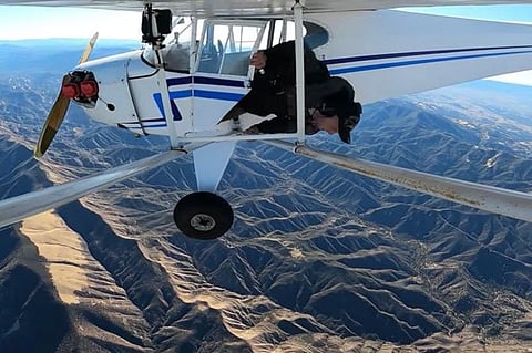 The dramatic footage shows Jacob, 29, ejecting from the single engine plane - selfie-stick in hand - and parachuting into the dense vegetation of the Los Padres National Forest.