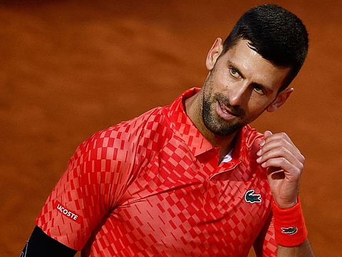 Serbia's Novak Djokovic reacts during his round of 64 match against Argentina's Tomas Martin Etcheverry.
