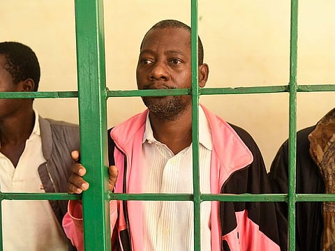Self-proclaimed pastor Paul Nthenge Mackenzie, (C) who set up the Good News International Church in 2003 and is accused of inciting cult followers to starve to death.