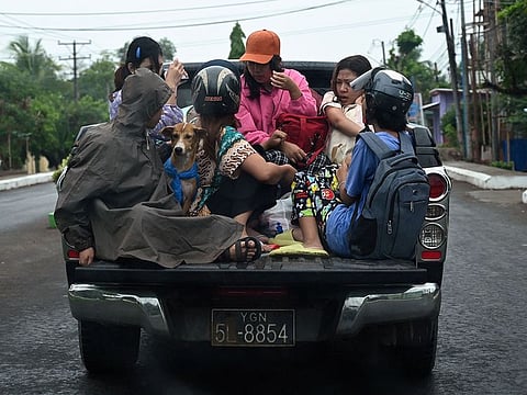 People evacuate in Sittwe in Myanmar's Rakhine state ahead of the landfall of Cyclone Mocha.