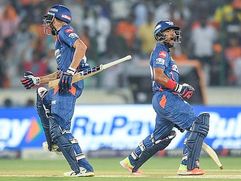 Lucknow Super Giants' Prerak Mankad (L) and Nicholas Pooran celebrate after winning the IPL match against Sunrisers Hyderabad at the Rajiv Gandhi International Cricket Stadium in Hyderabad on May 13, 2023.