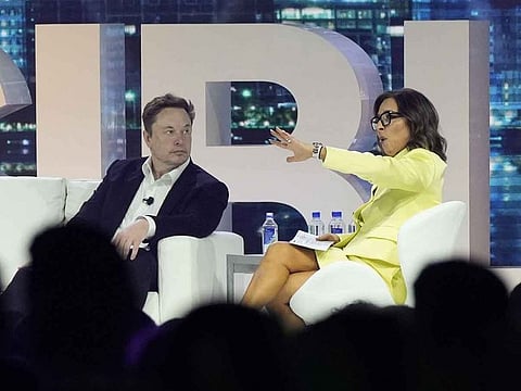 Elon Musk (left) with Linda Yaccarino.