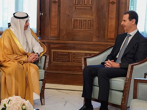 Syrian President Bashar Al Assad, right, with Saudi Arabia ambassador to Jordan Nayef Al Sadiri, in Damascus, on May 11, 2023. Assad received an invitation from Saudi Arabia to attend the upcoming Arab League summit.