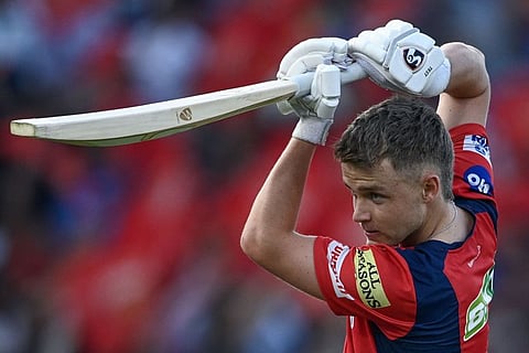 Punjab Kings' Sam Curran practices before the start of the IPL match.
