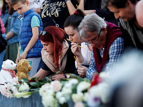 People light up candles to pay tribute for victims of Belgrade school mass shooting in Podgorica, Montenegro, May 5, 2023.