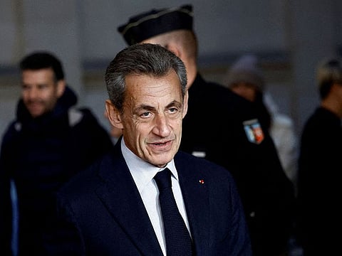 Former French President Nicolas Sarkozy arrives for his appeal trial on charges of corruption and influence peddling, at Paris courthouse, France, December 15, 2022.