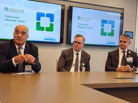 (Left to right) Dr Wesam Ahmed, Dr Stephen Grobmyer, and Dr Fadi Geara of the Cleveland Clinic Abu Dhabi's Oncology Institute speak ahead of a tour of the Fatima Bint Mubarak Centre
