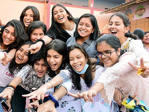 Students celebrate their success after the announcement of CBSE class 10th results, at Carmel Convent Higher Secondary School in Bhopal on Friday