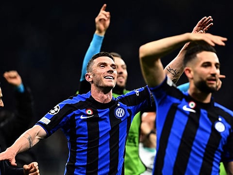 Inter Milan players celebrate after winning the Uefa Champions League semi-final second leg against AC Milan on Tuesday. Inter entered the final on a 3-0 aggregate.