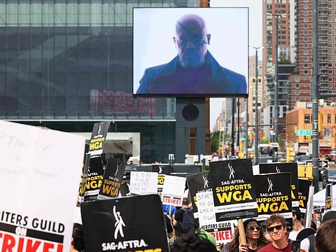 Writers Guild of America East members walk a picket line at the Disney Upfront event at the Javits Center on May 16, 2023 in New York City. Teachers Union President Randi Weingarten joined members of the WGA East as they held its recent picket line at an event for New York Upfronts week , a decades-old tradition where media companies stage lavish events to promote their lineups in an attempt to woo advertisers, during the third week of the Hollywood writers strike.