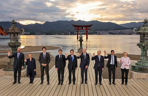 US President Joe Biden, Germany's Chancellor Olaf Scholz, Britain's Prime Minister Rishi Sunak, European Commission President Ursula von der Leyen, President of the European Council Charles Michel, Italy's Prime Minister Giorgia Meloni, Canada's Prime Minister Justin Trudeau, France's President Emmanuel Macron and Japan's Prime Minister Fumio Kishida attend a family photo session at Itsukushima Shrine during G7 leaders' summit in Hatsukaichi, Hiroshima prefecture western Japan May 19, 2023.