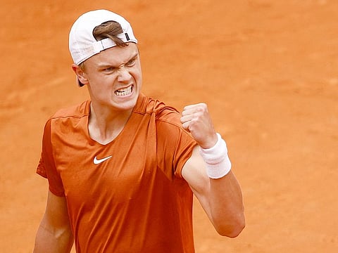 Denmark's Holger Rune reacts during his Italian Open semi final match against Norway's Casper Ruud, in Rome, on Saturday, May 20, 2023.