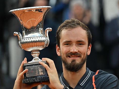 Russia's Daniil Medvedev poses with the trophy celebrating winning the final match of the Men's ATP Rome Open tennis tournament against Denmark's Holger Rune on the central court of Foro Italico in Rome.
