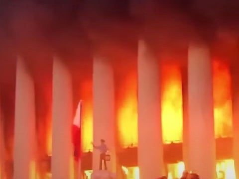 A screen grab shows the Manila Central Post Office going up in flames early on Monday, May 22, 2023. The fire is thought to have started in the maintenance room and the storage room for the Mega Manila Office are located on the south side of the basement.