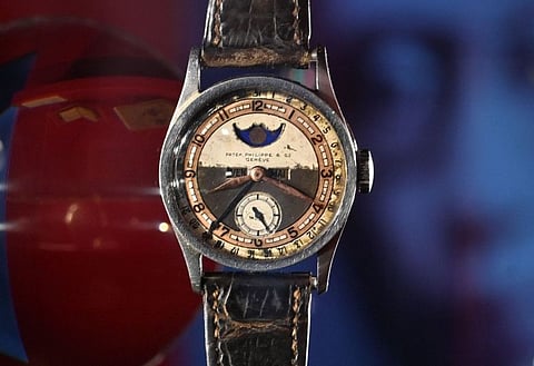 The Patek Philippe Ref 96 Quantieme Lune timepiece once owned by Aisin-Gioro Puyi, the Chinese Qing dynastys last emperor (R), is seen on display in Hong Kong.