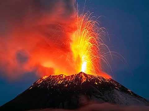 Incandescent materials, ash and smoke are spewed from the Popocatepetl volcano as seen from the Santiago Xalitzintla community, state of Puebla, Mexico.