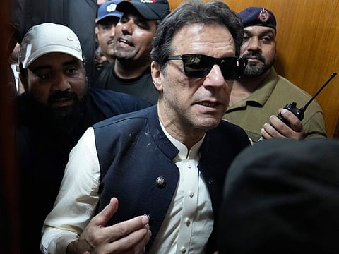 Imran Khan leaves court after an appearance in Lahore on May 19.